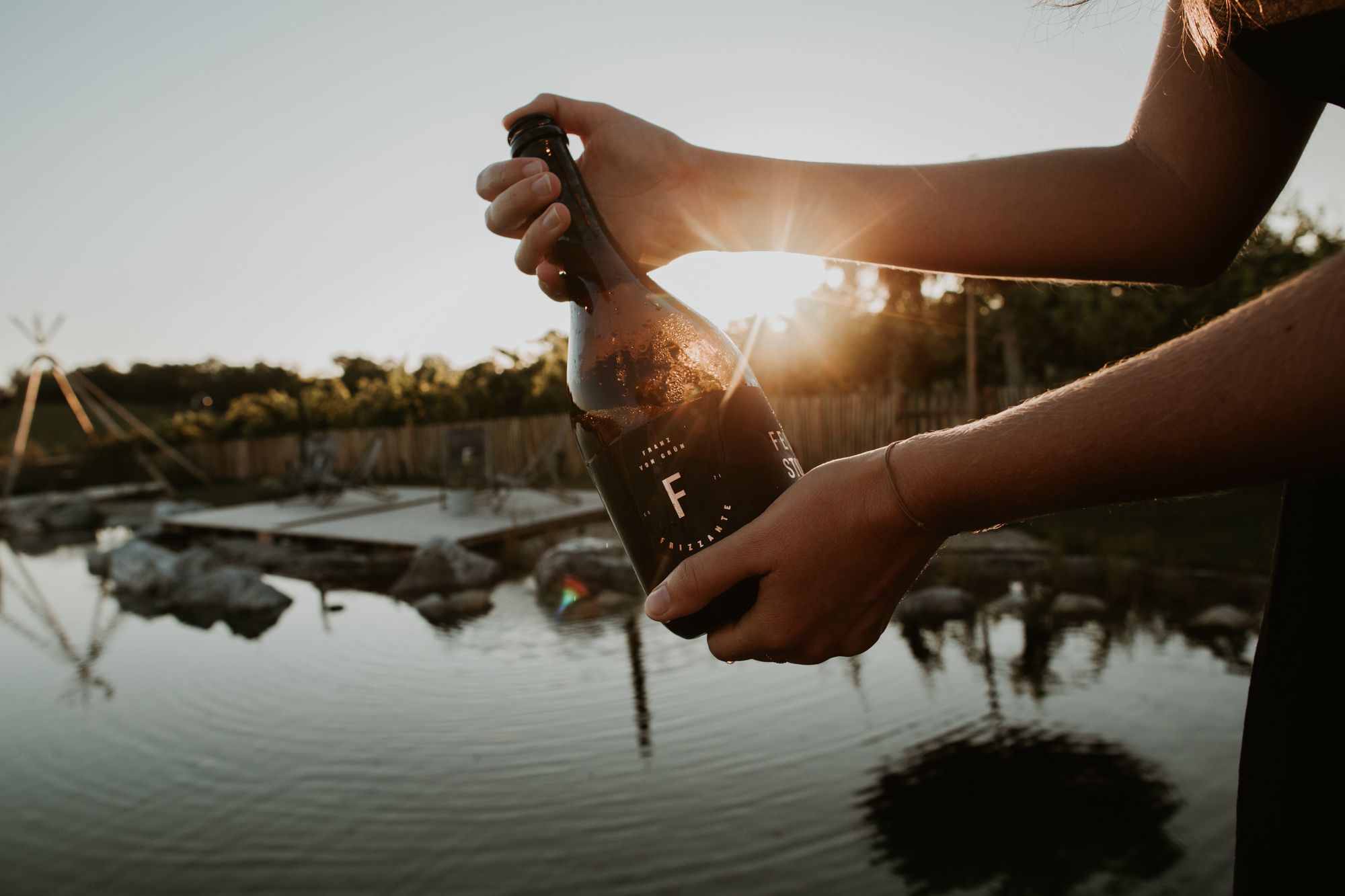 Wine bottle - pond in the background