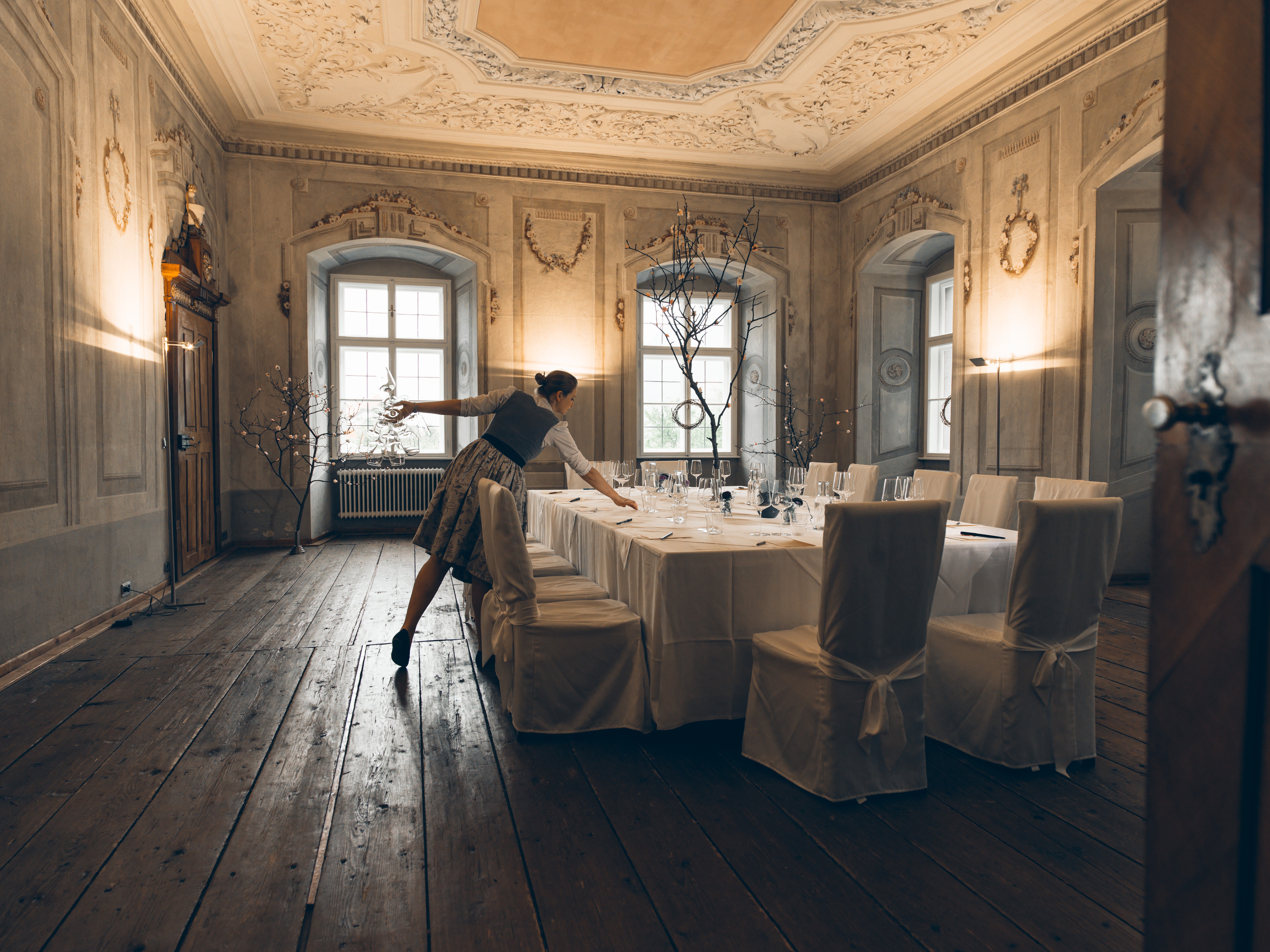 Historic Hofmeisterei Hirtzberger building with pink façade and red doors in the Wachau region.