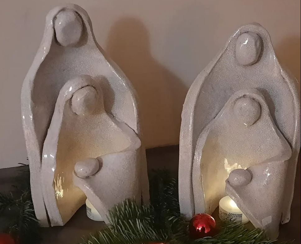 Handmade ceramic angels as decorative figurines.