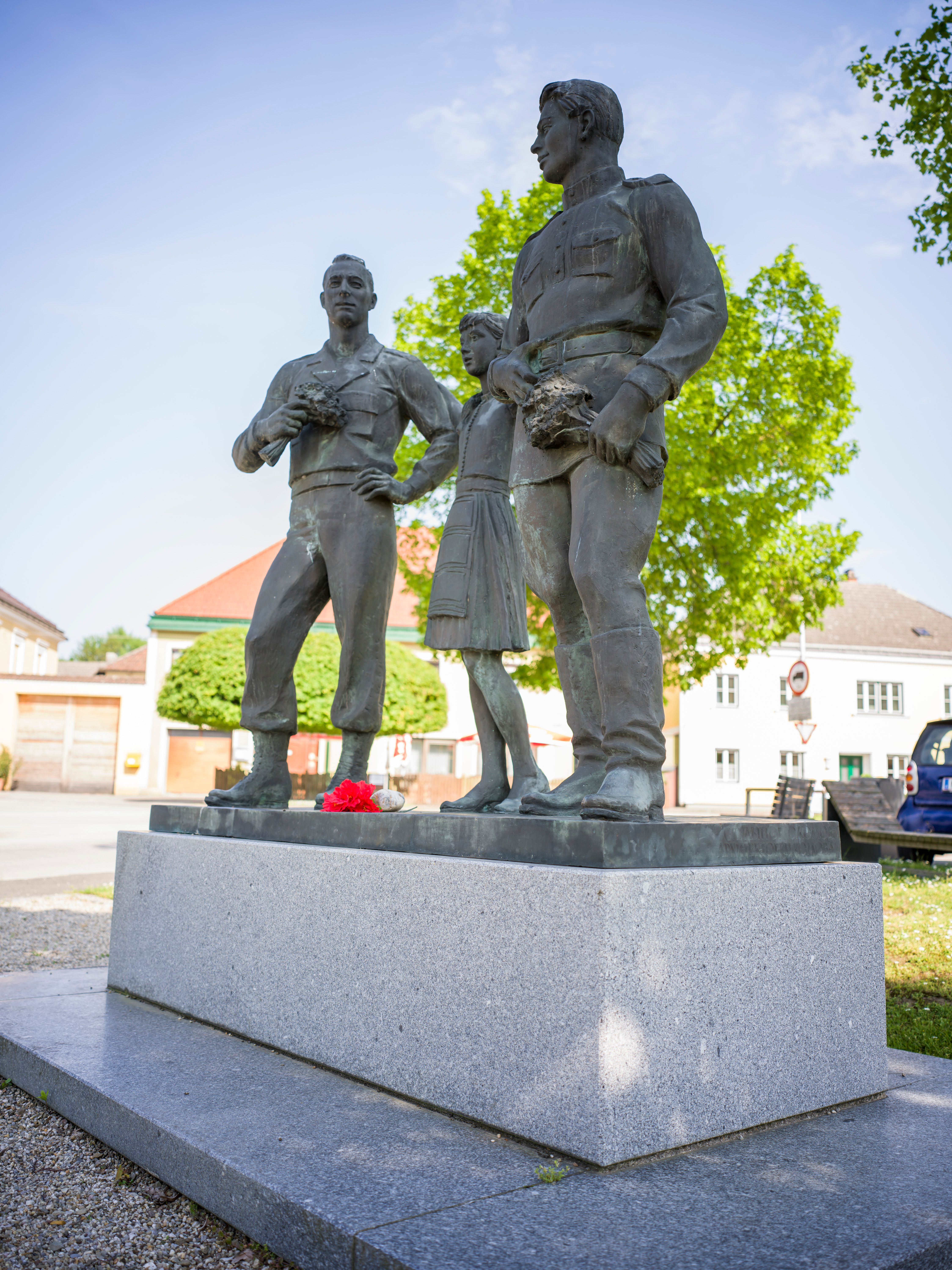 Exterior view of the Erlauf Peace Museum with sign 'Erlauf remembers'.