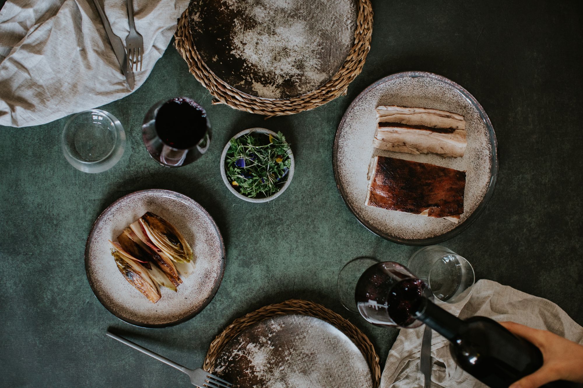 Plate with food, wine bottle and wine glass